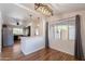 Dining area offering stylish lighting, a kitchen view, and a serene view of the outside scenery at 2214 N 7Th Ave, Phoenix, AZ 85007