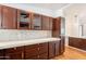 Updated kitchen with dark wood cabinets, stone countertops, and mosaic backsplash for a luxurious touch at 2214 N 7Th Ave, Phoenix, AZ 85007