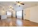Bright, open living room featuring wood-look floors, modern lighting fixtures, and access to a dining area at 2214 N 7Th Ave, Phoenix, AZ 85007