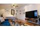 Stylish living room with modern furnishings, decor, and beautiful hardwood floors at 2214 N 7Th Ave, Phoenix, AZ 85007