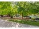 Scenic park view featuring a calm lake, lush greenery, and inviting park benches beneath mature trees at 2214 N 7Th Ave, Phoenix, AZ 85007