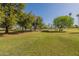 Open park with picnic tables and mature trees at 2214 N 7Th Ave, Phoenix, AZ 85007