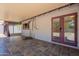 Covered patio with tile flooring, offering a comfortable outdoor living space with string lights at 2214 N 7Th Ave, Phoenix, AZ 85007