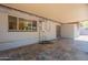 Inviting covered patio features tile flooring, a brick facade, and plenty of space for relaxation at 2214 N 7Th Ave, Phoenix, AZ 85007