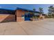 Exterior of a pool building with blue doors and trim, and a small landscaped area at 2214 N 7Th Ave, Phoenix, AZ 85007