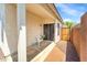 Covered back patio with a chair and gated access to the backyard at 2221 E Union Hills Dr # 148, Phoenix, AZ 85024