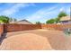 A low maintenance backyard featuring a gravel area, paved patio, and perimeter fence at 2221 E Union Hills Dr # 148, Phoenix, AZ 85024