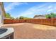 Large backyard featuring a brick perimeter wall and gravel landscaping, creating a private outdoor space at 2221 E Union Hills Dr # 148, Phoenix, AZ 85024