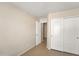 Bedroom with a large closet and neutral paint at 2221 E Union Hills Dr # 148, Phoenix, AZ 85024
