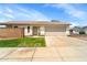 This single-story home includes a two-car garage, low maintenance landscaping, and neutral color palette at 2221 E Union Hills Dr # 148, Phoenix, AZ 85024