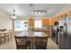 The kitchen features stainless steel appliances, an island with bar stool seating, and lots of sunlight at 2221 E Union Hills Dr # 148, Phoenix, AZ 85024