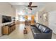 The living room includes an open floorplan, neutral color palette, and a ceiling fan at 2221 E Union Hills Dr # 148, Phoenix, AZ 85024
