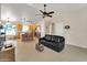 Open-concept living and dining features a ceiling fan, tile floors, and great natural light at 2221 E Union Hills Dr # 148, Phoenix, AZ 85024