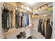 Organized walk-in closet with shelving and clothing rods for optimal storage at 2221 E Union Hills Dr # 148, Phoenix, AZ 85024