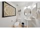 Chic powder room with pedestal sink, decorative mirror, and modern artwork at 2402 E 5Th St # 1520, Tempe, AZ 85288