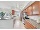 Well-lit kitchen featuring wood cabinets, stainless steel appliances, and ample counter space at 2402 E 5Th St # 1520, Tempe, AZ 85288