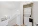 Upstairs landing featuring a conveniently located stacked washer and dryer at 2402 E 5Th St # 1520, Tempe, AZ 85288