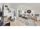 Bright living room with stylish furnishings, neutral decor, and access to an outdoor area at 2402 E 5Th St # 1520, Tempe, AZ 85288