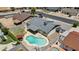 Aerial view of home featuring a backyard pool, patio area, and well-maintained landscaping at 2435 E Harmony Ave, Mesa, AZ 85204