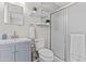 Updated bathroom features a vanity with storage, updated fixtures, and glass shower at 2435 E Harmony Ave, Mesa, AZ 85204