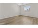 Bedroom featuring hardwood flooring, neutral color walls and bright natural light at 2435 E Harmony Ave, Mesa, AZ 85204