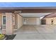 Covered carport featuring an extra storage room with access to the backyard at 2435 E Harmony Ave, Mesa, AZ 85204