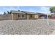 Inviting home featuring a covered carport and low maintenance rock landscaping at 2435 E Harmony Ave, Mesa, AZ 85204