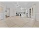 Open floorplan showcases the kitchen with a breakfast bar and stainless steel appliances at 2435 E Harmony Ave, Mesa, AZ 85204