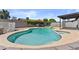 A lovely pool featuring ample space for swimming with diving board in a fenced backyard at 2435 E Harmony Ave, Mesa, AZ 85204