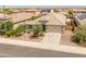 An aerial view showcases a single-story home with desert landscaping and a private backyard at 26032 W Quail Ave, Buckeye, AZ 85396