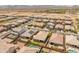 Aerial view of a suburban neighborhood showcasing homes with well-maintained yards and pools at 26032 W Quail Ave, Buckeye, AZ 85396