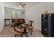 Sitting room features a chess table, bar area, and decorative accents at 26032 W Quail Ave, Buckeye, AZ 85396