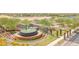 Aerial view of Festival Ranch entrance featuring stone walls, a fountain, and decorative posts at 26032 W Quail Ave, Buckeye, AZ 85396