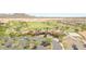 Aerial shot of a golf club and community featuring beautifully landscaped grounds and well-maintained parking at 26032 W Quail Ave, Buckeye, AZ 85396