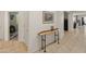 Inviting hallway with decorative table, showcasing access to various rooms at 26032 W Quail Ave, Buckeye, AZ 85396