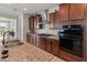 Close up of the kitchen with stainless steel appliances and granite countertops at 26032 W Quail Ave, Buckeye, AZ 85396
