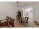 Inviting living room featuring a chess table, wine rack, and access to a conveniently located powder room at 26032 W Quail Ave, Buckeye, AZ 85396