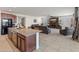 Open-concept kitchen and living room area, great for entertaining guests at 26032 W Quail Ave, Buckeye, AZ 85396
