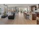 Open floor plan with a spacious living room, kitchen, and dining area at 26032 W Quail Ave, Buckeye, AZ 85396