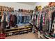 Spacious walk-in closet with ample storage for clothing, shoes, and accessories at 26032 W Quail Ave, Buckeye, AZ 85396