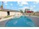Relaxing backyard featuring a pool, artificial grass, and mature landscaping at 2731 N 23Rd Ave, Phoenix, AZ 85009