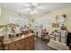 Spacious bedroom showcasing a ceiling fan, wood-look floors, and an abundance of natural light at 2731 N 23Rd Ave, Phoenix, AZ 85009