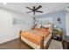 Serene main bedroom featuring shuttered windows, warm lighting, and wood-style tile flooring at 2731 N 23Rd Ave, Phoenix, AZ 85009