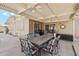 Covered patio with ceiling fans, BBQ, outdoor seating, and access to the backyard at 2731 N 23Rd Ave, Phoenix, AZ 85009