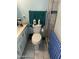 Compact bathroom with functional layout, including toilet, towel rack, and shower stall at 2840 W Marlette Ave, Phoenix, AZ 85017