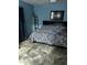 Comfortable bedroom with stylish patterned bedding and neutral-toned flooring, creating a relaxing ambiance at 2840 W Marlette Ave, Phoenix, AZ 85017