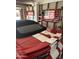 Garage interior with a red sports car, American flag, and organizational ladder at 2840 W Marlette Ave, Phoenix, AZ 85017