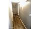 Inviting hallway with wood-look flooring and neutral paint tones, leading to other rooms in the home at 2840 W Marlette Ave, Phoenix, AZ 85017