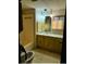 Bathroom featuring a single sink vanity, shower-tub combo, and modern fixtures at 3104 E Broadway Rd # 295, Mesa, AZ 85204