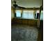 Cozy bedroom featuring carpet flooring, a ceiling fan, and a built-in cabinet at 3104 E Broadway Rd # 295, Mesa, AZ 85204